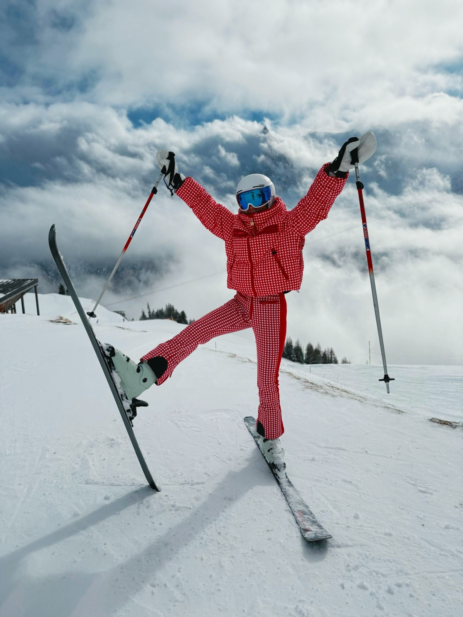 On the mountain in The Louk — red star-print suit above the clouds